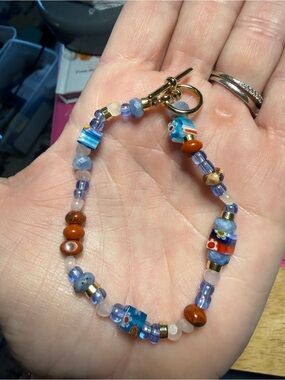 red jasper and kyanite gemstones with glass and crystal accents beads